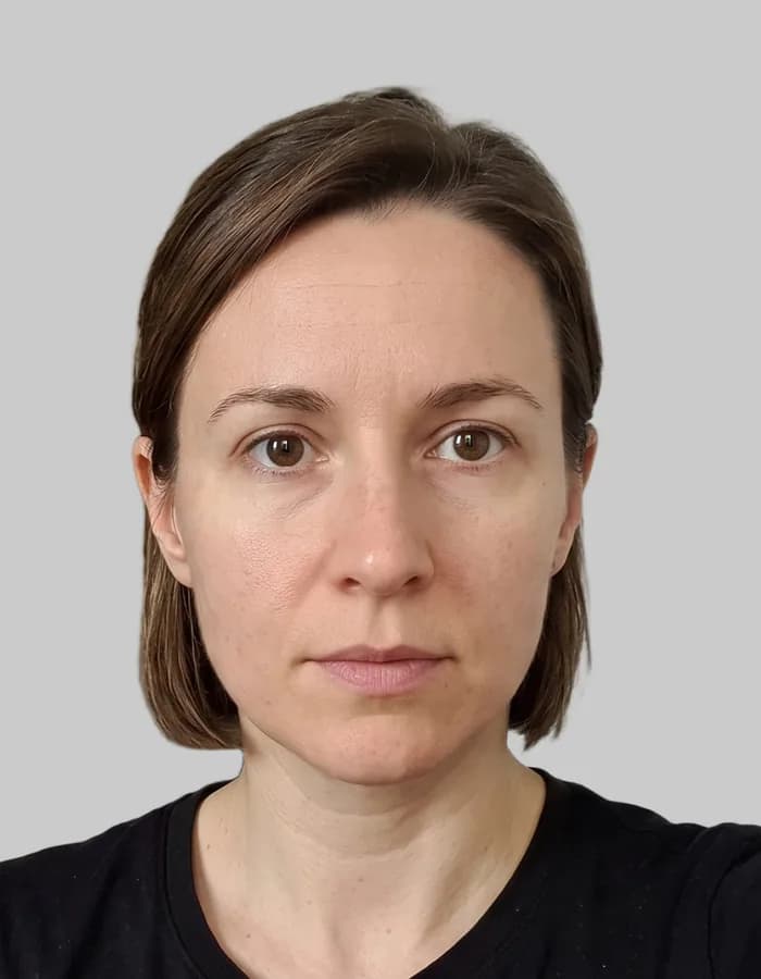 The finished 35 by 45 mm passport photo on a plain light-grey background